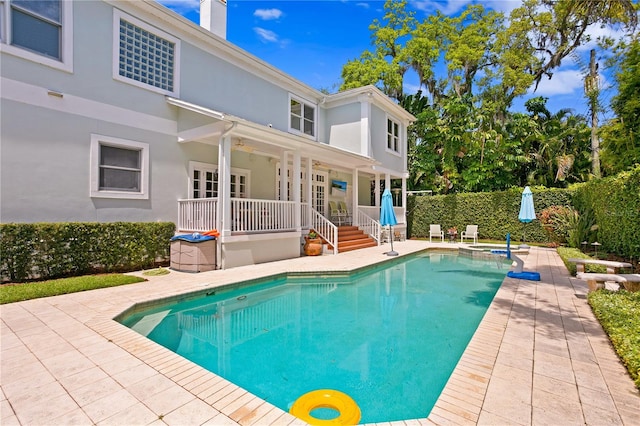 view of swimming pool featuring a patio