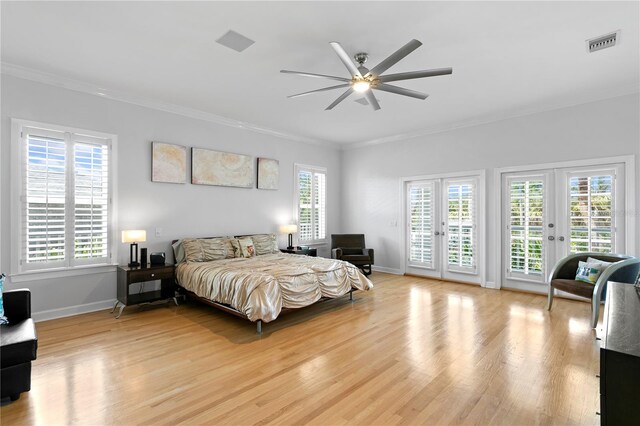 bedroom with ceiling fan, light hardwood / wood-style flooring, access to exterior, ornamental molding, and french doors