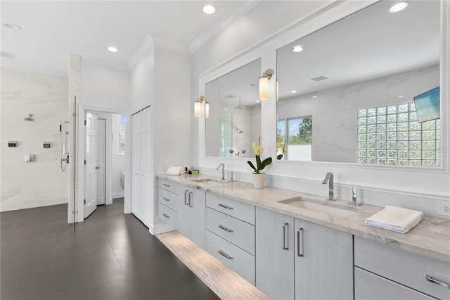 bathroom featuring crown molding, double vanity, and tile floors