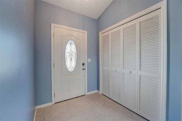 entrance foyer with light tile patterned floors