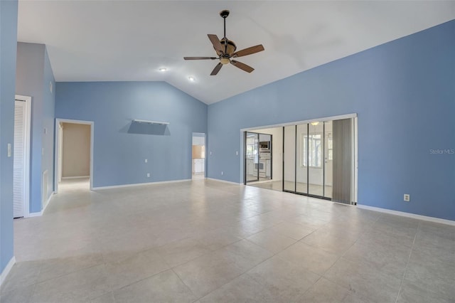 spare room with ceiling fan, light tile patterned flooring, and high vaulted ceiling