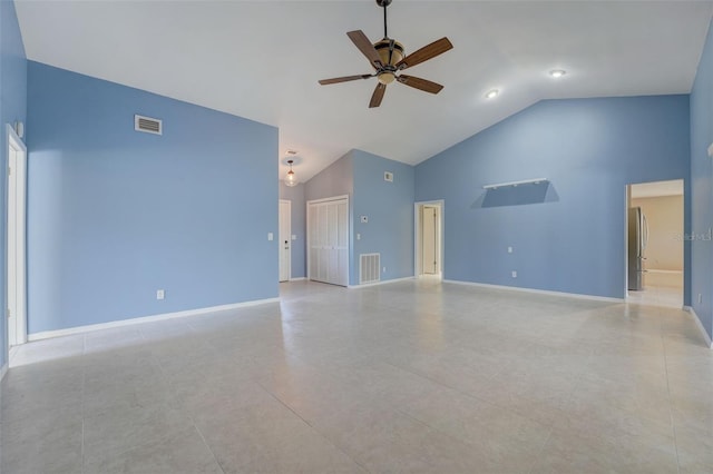 unfurnished living room with ceiling fan, high vaulted ceiling, and light tile patterned floors