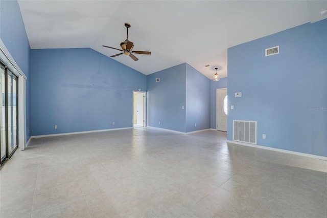 empty room with ceiling fan and high vaulted ceiling