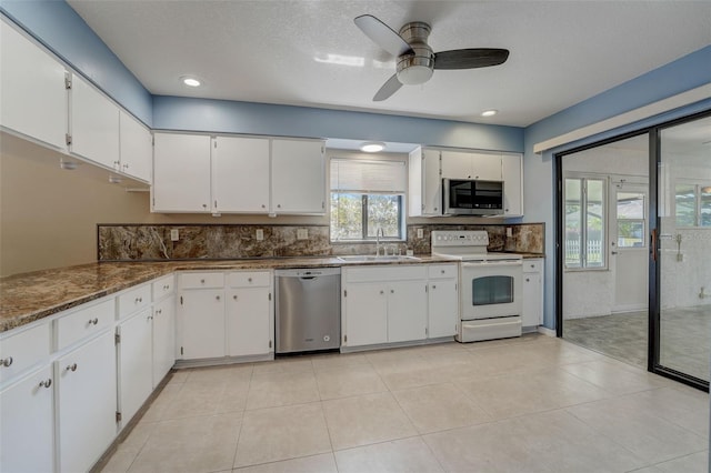 kitchen featuring white cabinetry, sink, ceiling fan, and appliances with stainless steel finishes