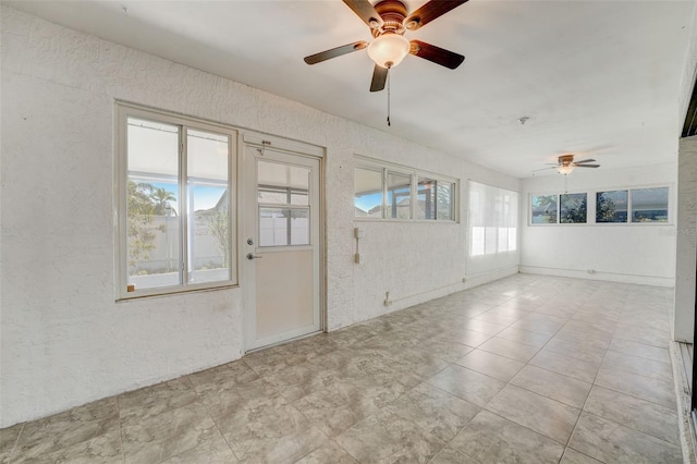 spare room with ceiling fan