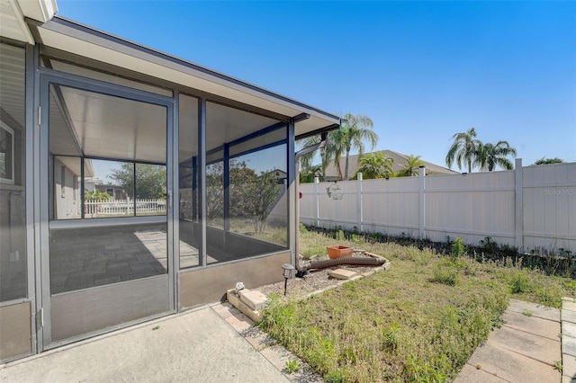 view of yard with a sunroom