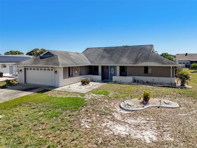 single story home with a front lawn and a garage