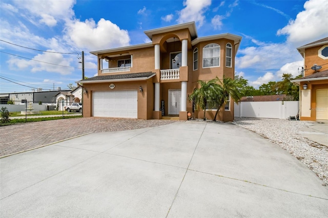 view of front of house with a balcony and a garage