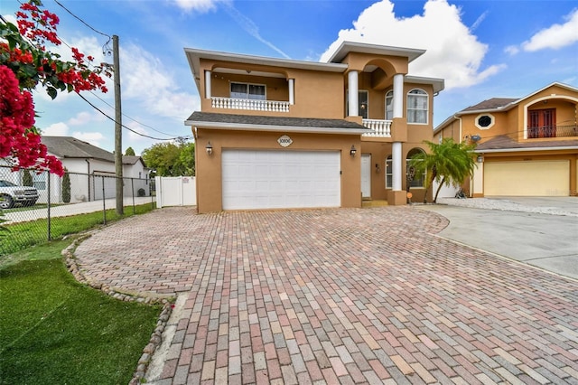 view of front of property with a balcony and a garage