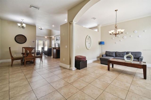 living room with a chandelier, crown molding, decorative columns, and light tile floors