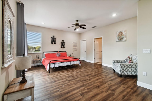 bedroom with ceiling fan and dark wood-type flooring