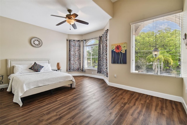 bedroom with dark wood-type flooring and ceiling fan