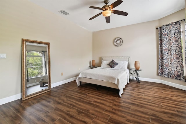 bedroom with dark hardwood / wood-style floors and ceiling fan