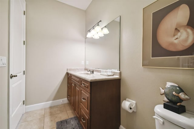 bathroom featuring vanity, toilet, and tile flooring