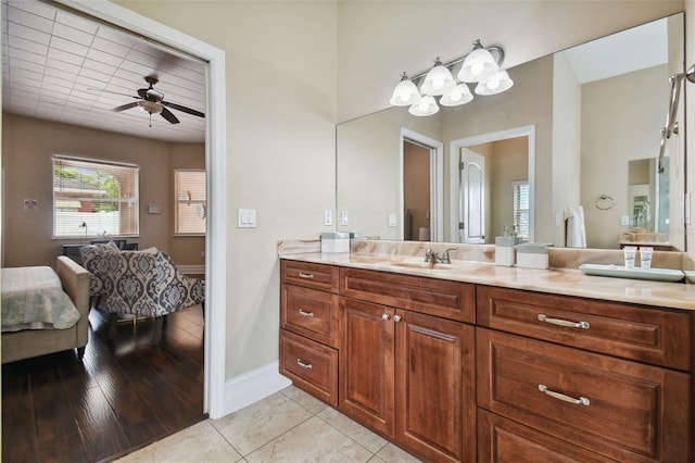 bathroom featuring hardwood / wood-style floors, ceiling fan, and vanity