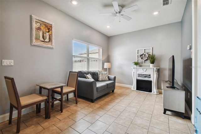 interior space with ceiling fan and light tile floors