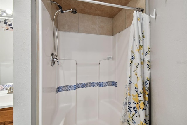 bathroom with vanity and a shower with curtain