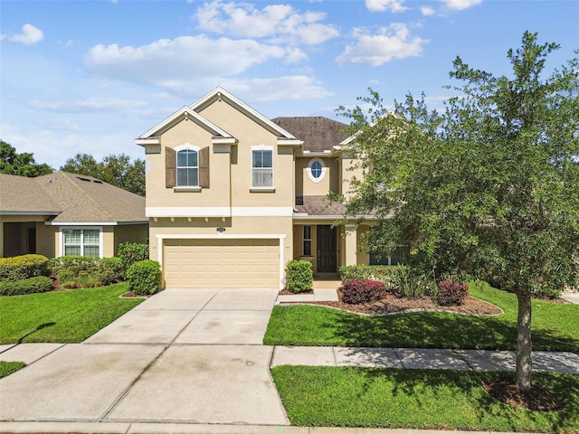 view of front of home featuring a front lawn and a garage