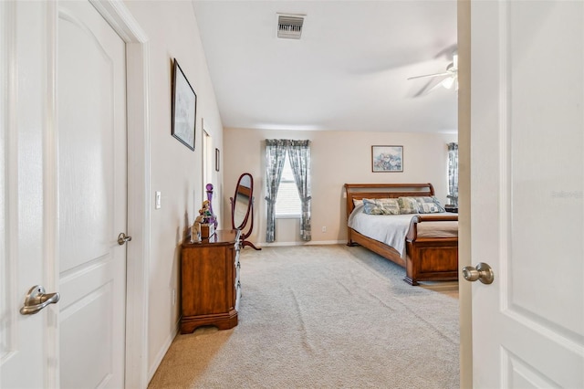 bedroom with ceiling fan and light colored carpet