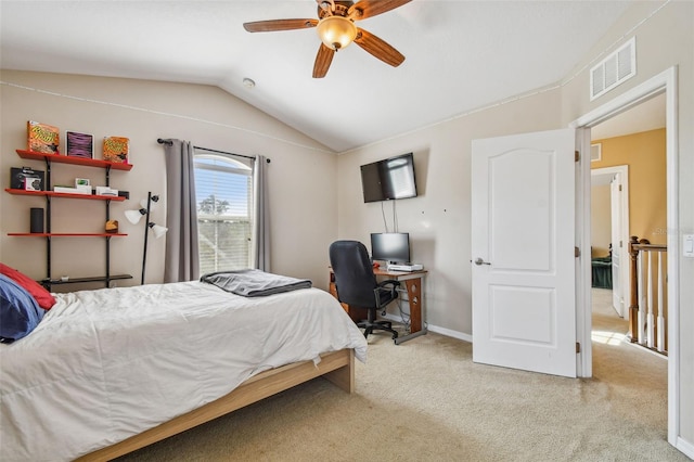 carpeted bedroom featuring ceiling fan and vaulted ceiling