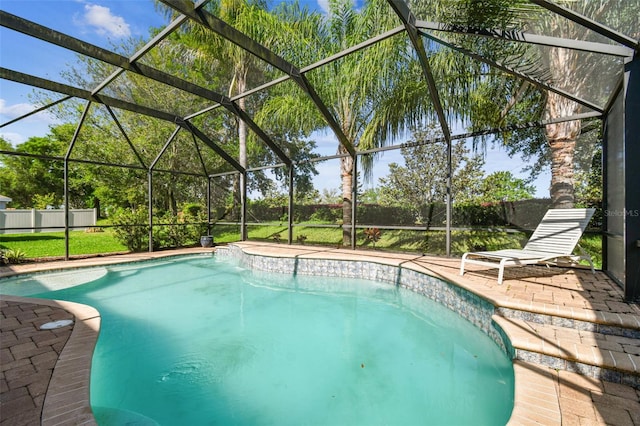 view of swimming pool with glass enclosure