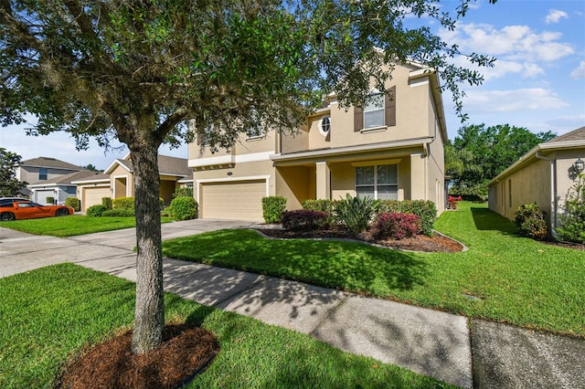 view of front of home with a front yard and a garage