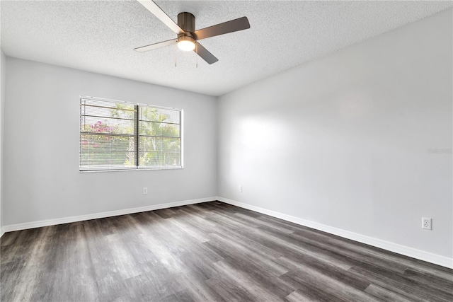 unfurnished room featuring dark wood-type flooring, ceiling fan, and a textured ceiling