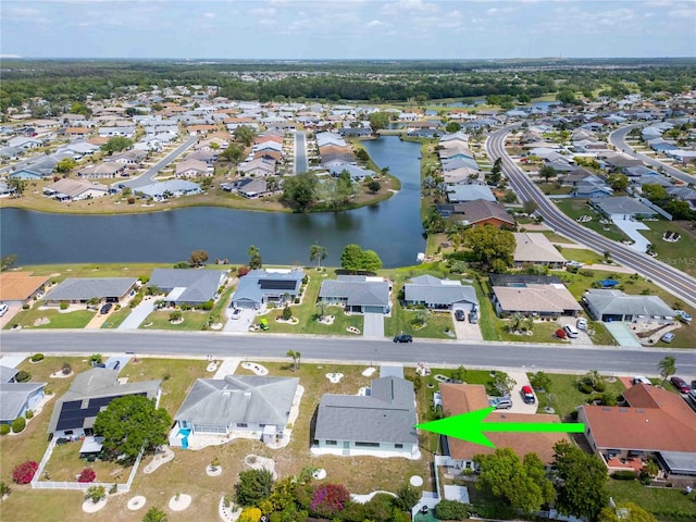 birds eye view of property with a water view