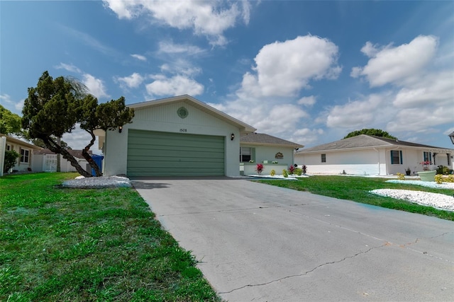 ranch-style home with a front yard and a garage