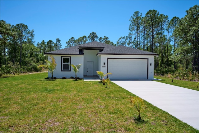 view of front of property featuring a garage and a front lawn