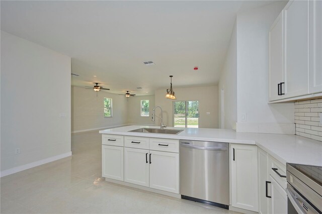 kitchen with sink, dishwasher, ceiling fan, and white cabinetry