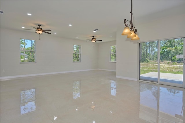 tiled empty room featuring a wealth of natural light and ceiling fan