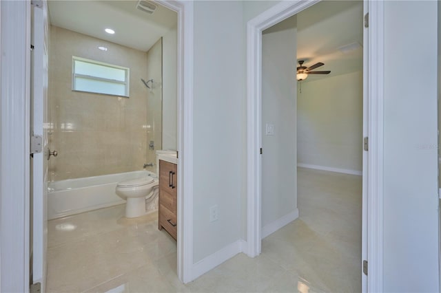 full bathroom with tiled shower / bath, ceiling fan, tile floors, and vanity