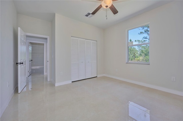 unfurnished bedroom featuring a closet and ceiling fan