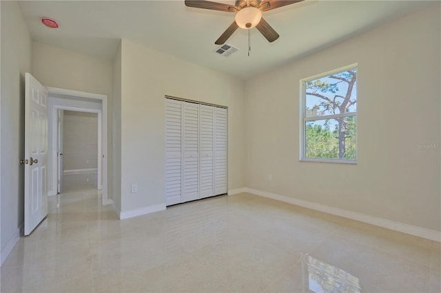 unfurnished bedroom featuring a closet, ceiling fan, and light tile floors