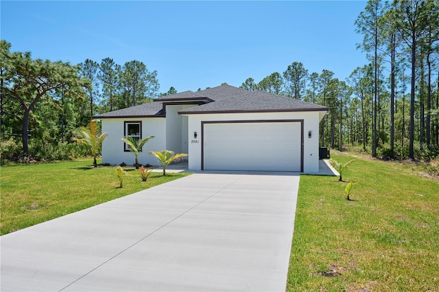 view of front of home featuring a front lawn and a garage