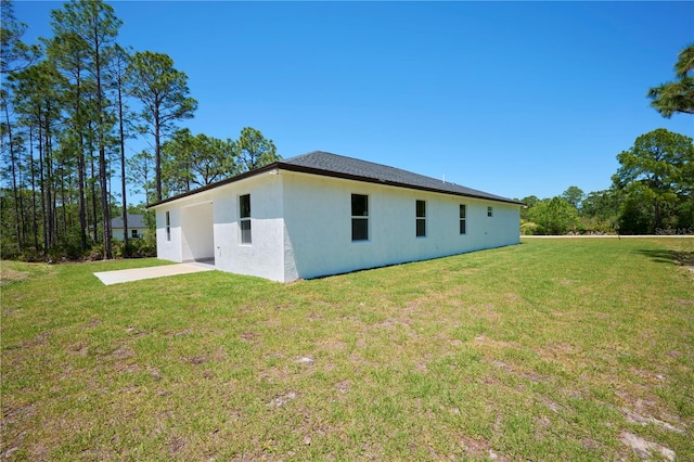 back of house with a yard