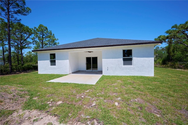 back of property featuring a patio area, ceiling fan, and a lawn