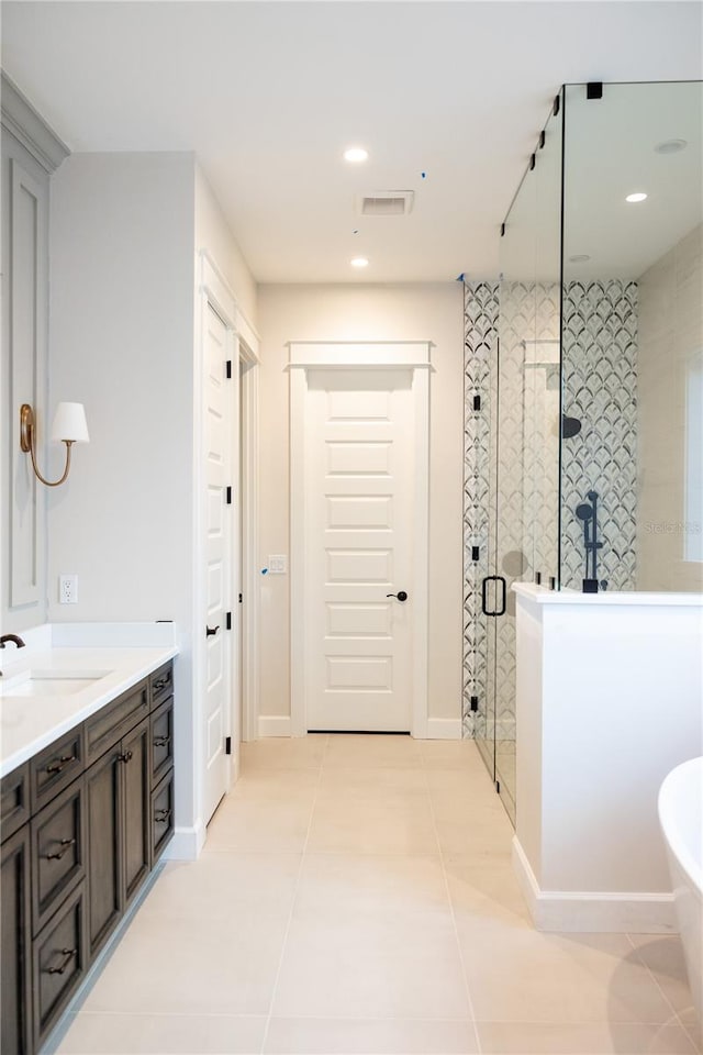 bathroom featuring vanity, separate shower and tub, and tile patterned flooring