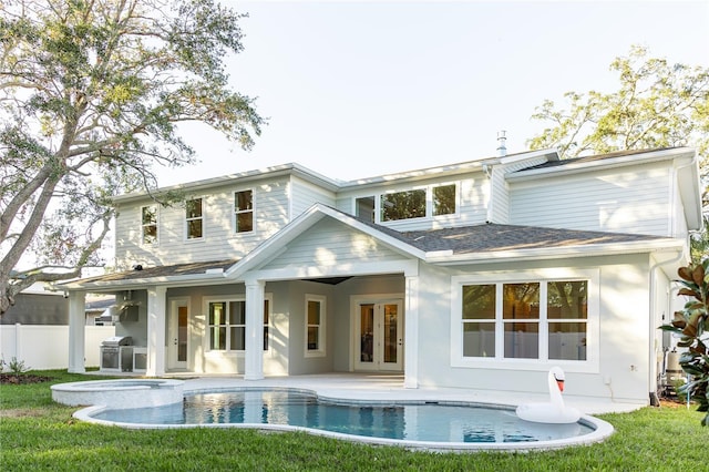 back of property featuring french doors and a patio