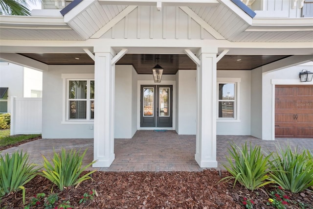 doorway to property with a garage