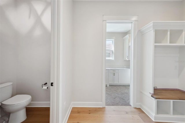 mudroom with light hardwood / wood-style floors