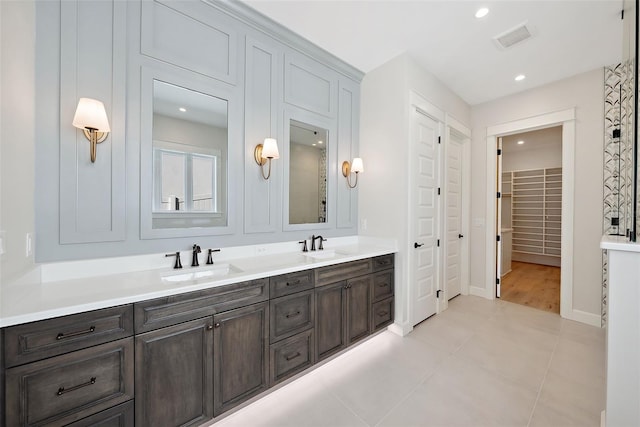 bathroom with vanity and tile patterned floors