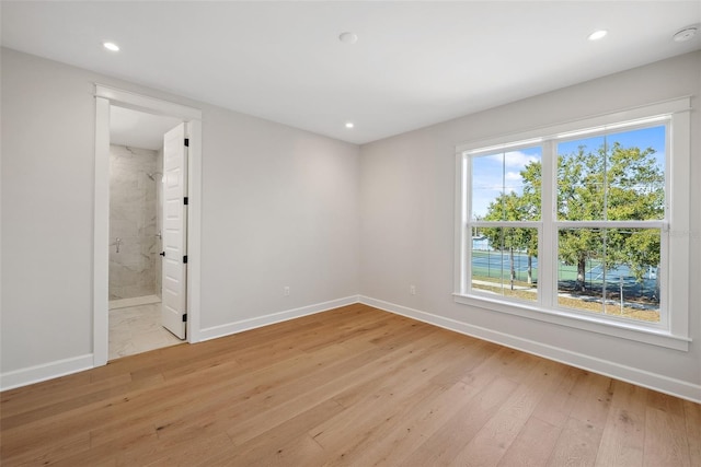 unfurnished room with light hardwood / wood-style floors