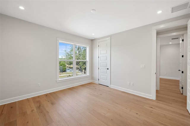 unfurnished room with light hardwood / wood-style flooring