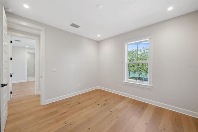 spare room featuring light wood-type flooring