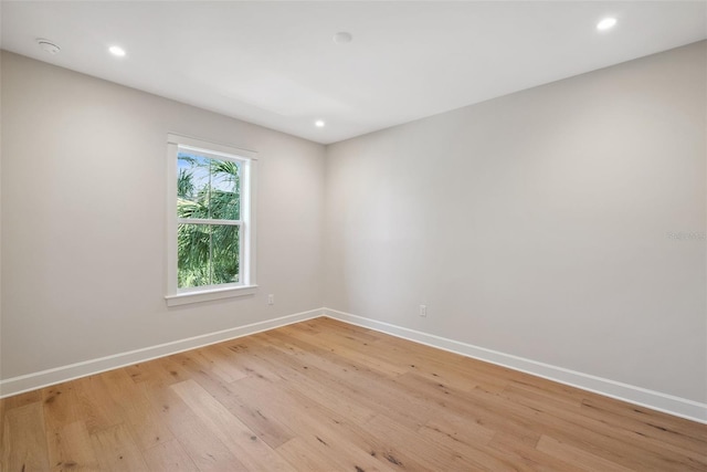 unfurnished room with light hardwood / wood-style floors