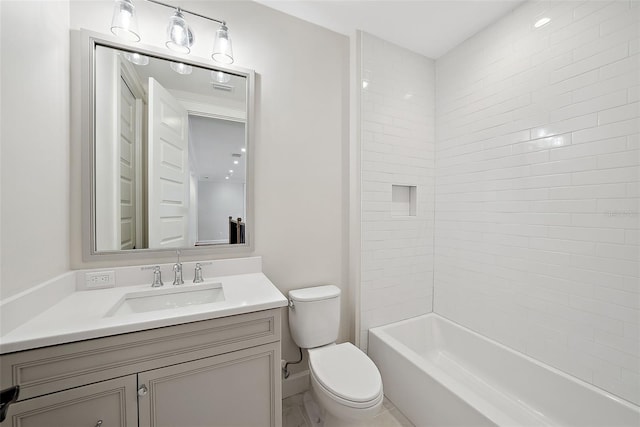 full bathroom with tiled shower / bath, vanity, and toilet