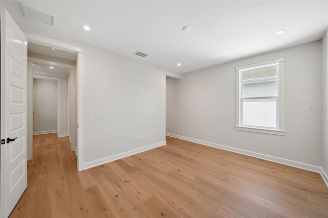 spare room featuring light wood-type flooring