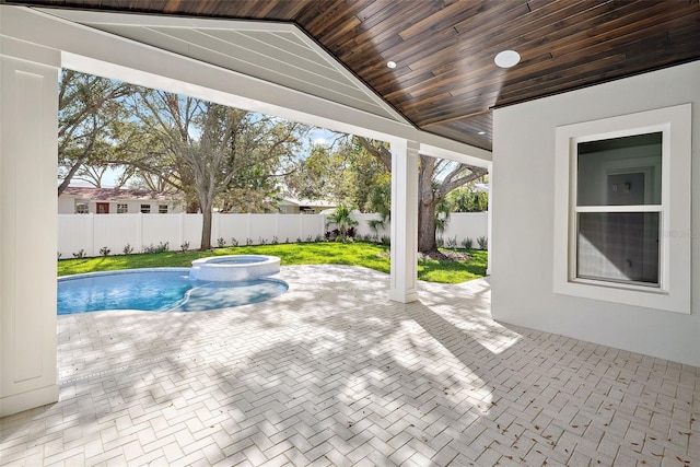view of pool featuring an in ground hot tub and a patio area